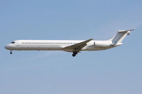 Arrival of a white passenger plane Stock Photos