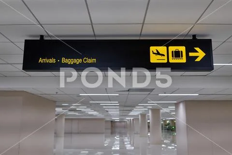 Arrivals baggage claim information board sign international airport terminal Stock Photos