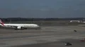 Arriving Boeing 777 Emirates driving on airfield to gate at airport Hamburg 4k or 4k+ Resolution