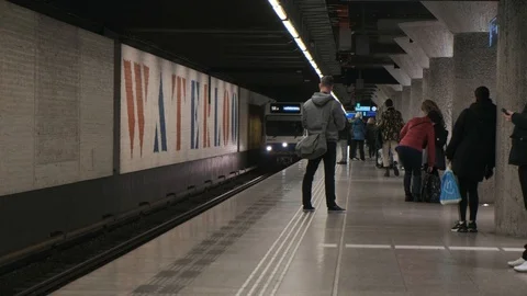 Arriving train at Waterloo plain subway station in Amsterdam Stock Footage 106943088