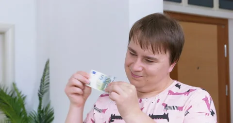 Arrogant plump man laughs stretching banknote in hands Video stock 237130838
