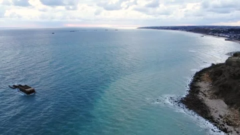 Arromanches les Bains D-Day landing site Cap Manvieux cliffs and Gold Beach.. Stock Footage 341883244