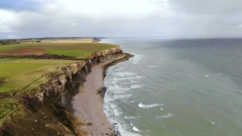 Arromanches les Bains D-Day landing site Cap Manvieux cliffs and Gold Beach.. Stock Footage 341883353