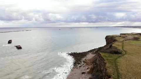 Arromanches les Bains D-Day landing site Cap Manvieux cliffs and Gold Beach.. Stock Footage 341883366
