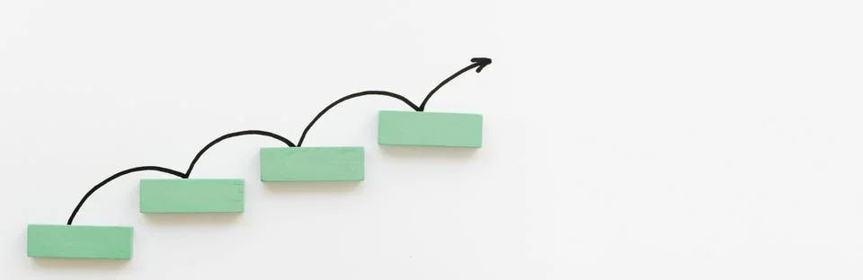 Arrow bouncing up off block. High quality photo Stock Photos