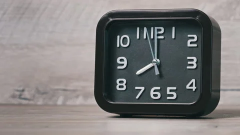 An Arrow Clock of Square Shape on Wooden... | Stock Video | Pond5