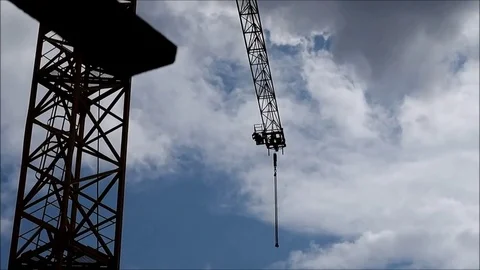 Arrow of a crane and the man against the sky Stock Footage 82273428