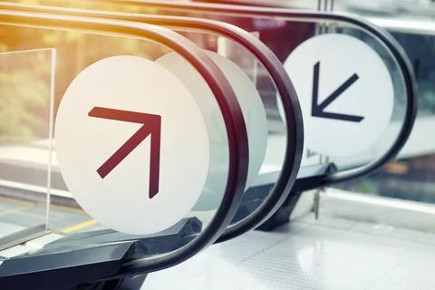 Arrow direction at escalator automatic ladder indicator way to up or down sid Stock Photos