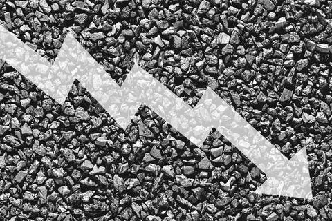 Arrow down on coal background. The concept of falling prices, mining, impor.. Stock Photos