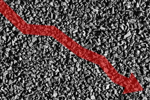 Arrow down on coal background. The concept of falling prices, mining, impor.. Stock Photos