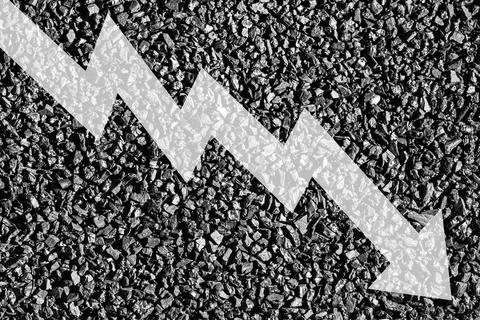 Arrow down on coal background. The concept of falling prices, mining, impor.. Stock Photos