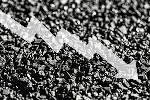 Arrow down on coal background. The concept of falling prices, mining, impor.. Stock Photos