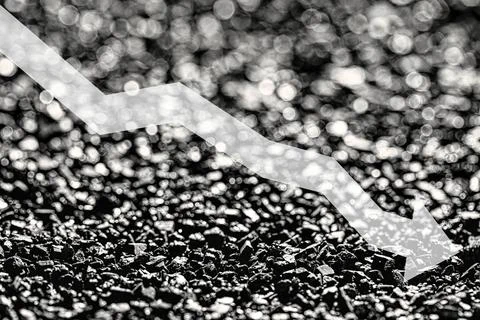 Arrow down on coal background. The concept of falling prices, mining, impor.. Stock Photos