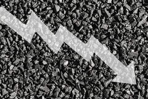 Arrow down on coal background. The concept of falling prices, mining, impor.. Stock Photos