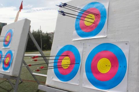 Arrow flying into the target Stock Photos