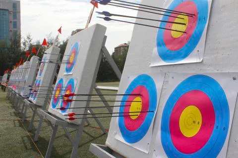 Arrow flying into the target Stock Photos