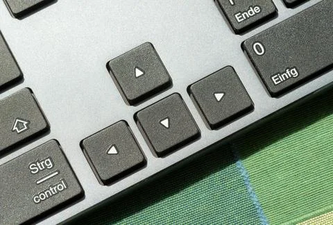 Arrow keys on a modern computer desktop PC keyboard, digital world navigati.. Stock Photos