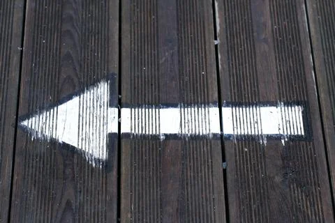 Arrow painted on the ground Stock Photos