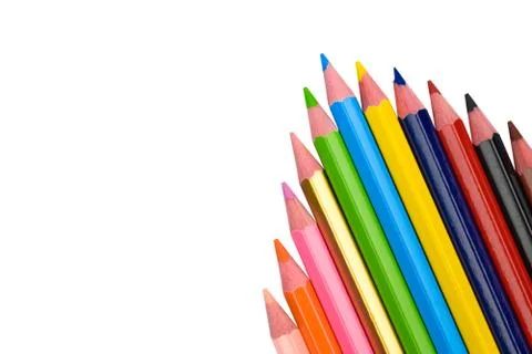 An arrow pattern made with some different wood pencil crayons on white backgr Stock Photos