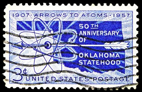 Arrow piercing atomic symbol, 50th Anniversary of Oklahoma Statehood, circa.. Stock Photos