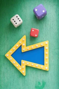 Arrow pointer and dice at the casino gambling house Foto stock