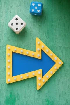 Arrow pointer and dice at the casino gambling house Photos