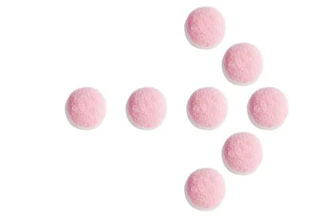 The arrow pointer of pink and white candies and jelly on white background Stock Photos