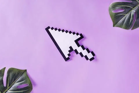 Arrow pointer is pixelated on pastel purple velvet background Foto stock