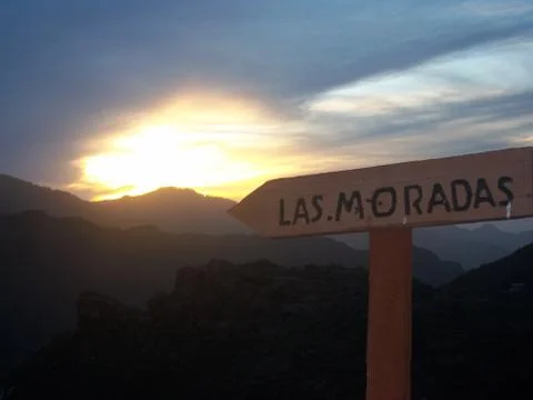 Arrow pointing at the sunset Stock Photos