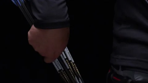 Arrow is pulled out and spun around by archer in preparation to shoot Stock-Footage 148868328