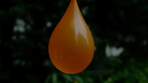 Arrow puncturing a water balloon, Ultra Slow Motion Stock Footage 86579713