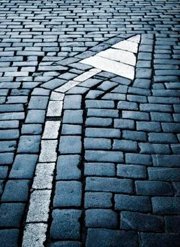 Arrow to the right on the stone path Stock Photos