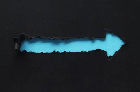 Arrow shape in torn paper Stock Photos