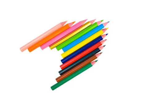 Arrow shaped made with some different colored wood pencil crayons on a white Stock Photos
