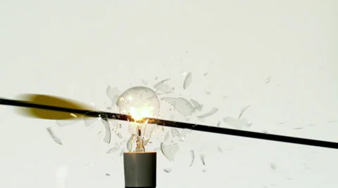 Arrow shooting through light bulb on white background 库存影片 36914167