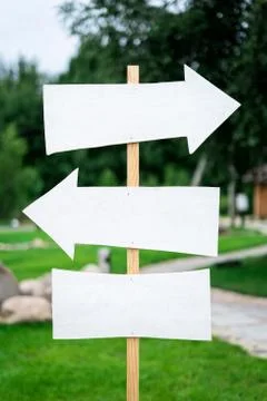 Arrow sign with pointers and a place for the signature on the column Stock Photos