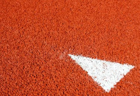 A arrow sign on running track Stock Illustration