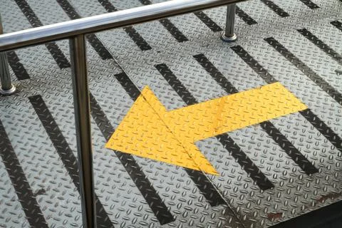 Arrow sign on walking path Stock Photos