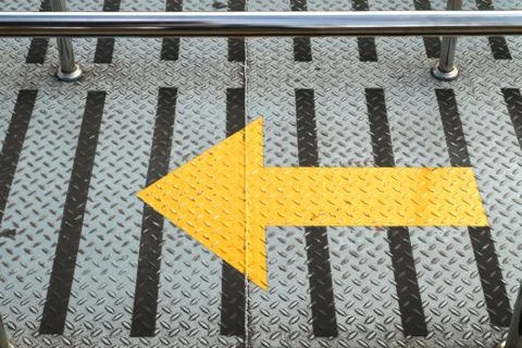 Arrow sign on walking path Stock Photos
