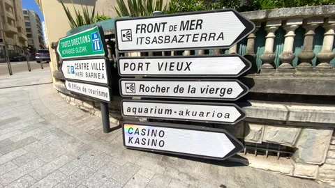 Arrow signs pointing towards local landmarks in Biarritz, France Stockbeeldmateriaal 340151199