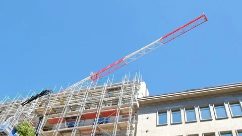 Arrow of the working crane over the building under construction. Stock Footage 89905594