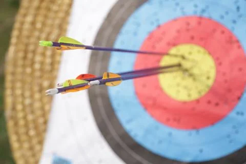 Arrows in archery target on archery range Stock Photos