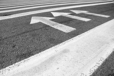 Arrows at the asphalt Stock Photos