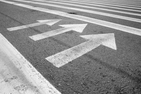 Arrows at the asphalt Stock Photos
