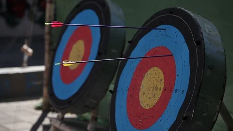 Arrows fall into the target on open air summer day Stock Footage 95048694