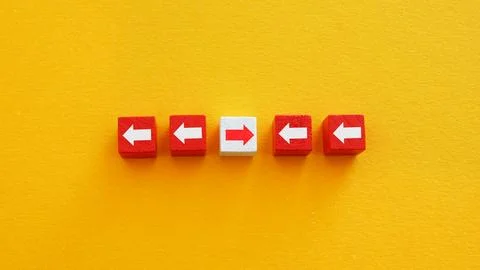 Arrows with one pointing in the opposite direction. Divergence concept. 写真素材