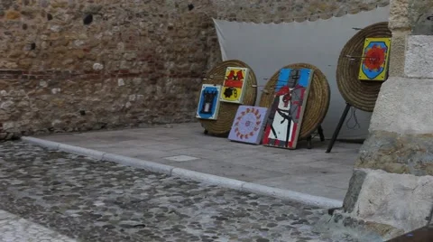 Arrows striking a medieval target inside a castle Stock Footage 66964610