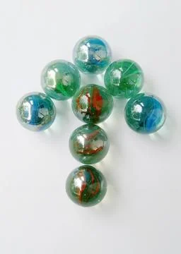 Arrows from toy marbles Stock Photos