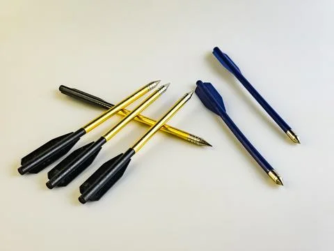 Arrows for a training crossbow on a white background. They are located chao.. Stock Photos