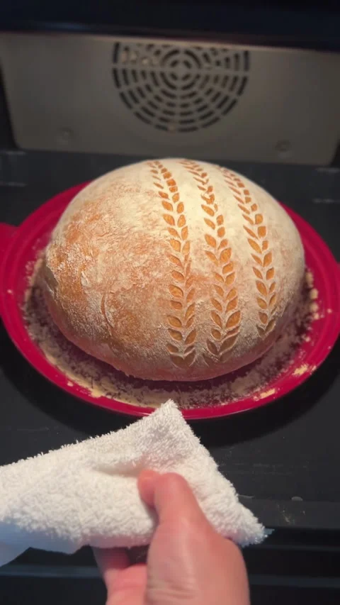 The Art of Artisan Bread Baking Done Perfectly in a Dutch Oven for a Delicious Stock Footage 306079368